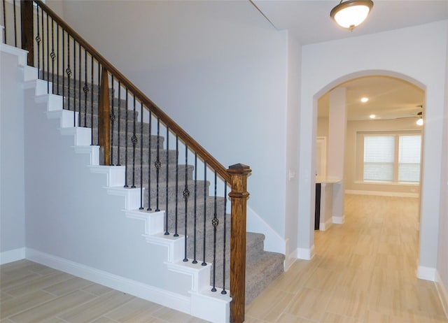 staircase with hardwood / wood-style flooring