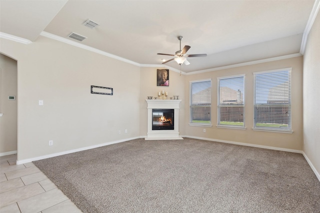 unfurnished living room with ceiling fan, ornamental molding, and light tile patterned floors