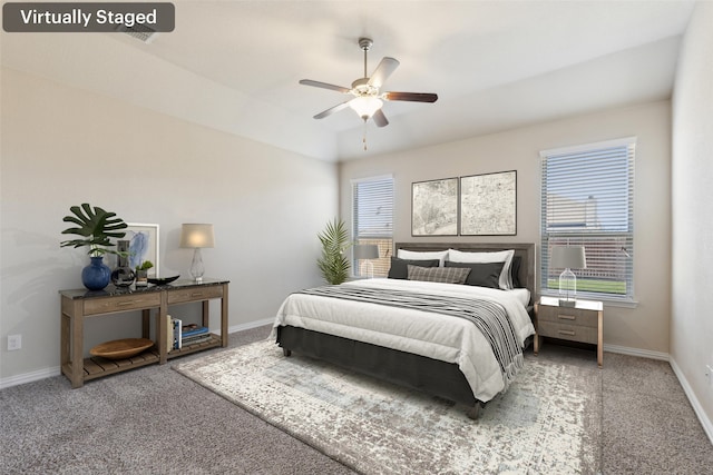 bedroom featuring ceiling fan and carpet