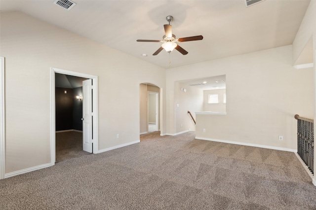 unfurnished living room featuring lofted ceiling, carpet, and ceiling fan