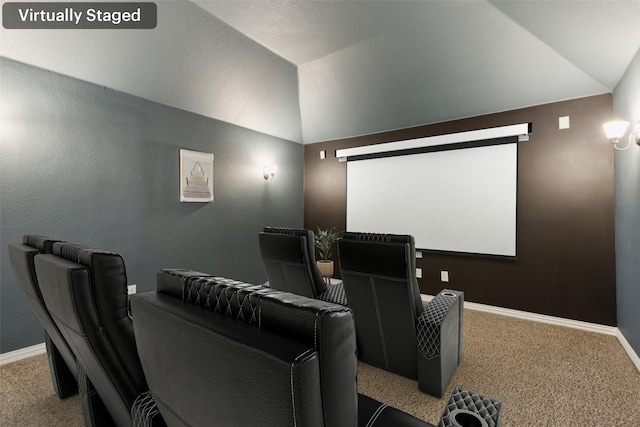 home theater with carpet flooring and vaulted ceiling