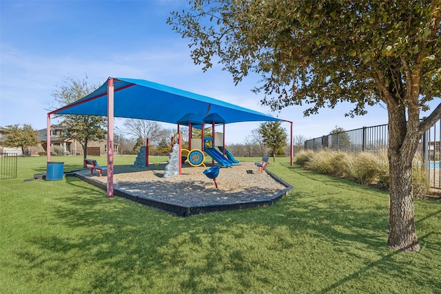 view of playground with a lawn