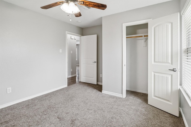 unfurnished bedroom featuring carpet flooring, ceiling fan, and a closet