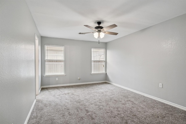 carpeted empty room with ceiling fan