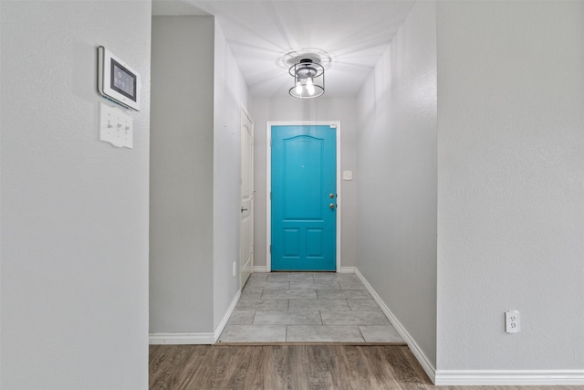 doorway to outside with light hardwood / wood-style flooring