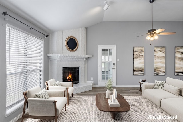 6329 Peggy Dr, Fort Worth, TX 76133 - living room featuring a fireplace, wood finished floors, lofted ceiling, baseboards, and ceiling fan