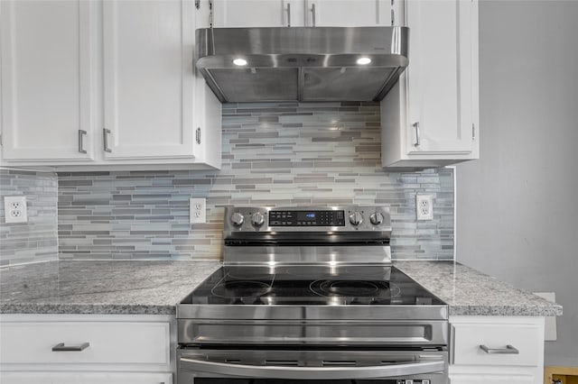 6329 Peggy Dr, Fort Worth, TX 76133 - kitchen featuring extractor fan, white cabinets, stainless steel range with electric cooktop, and tasteful backsplash