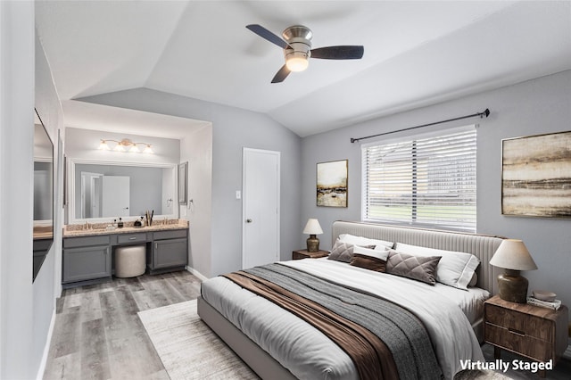 6329 Peggy Dr, Fort Worth, TX 76133 - bedroom with vaulted ceiling, baseboards, connected bathroom, light wood finished floors, and a ceiling fan