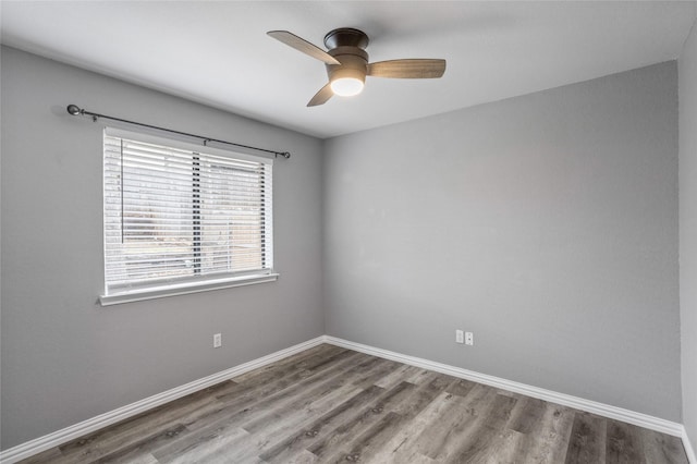 empty room with hardwood / wood-style flooring and ceiling fan