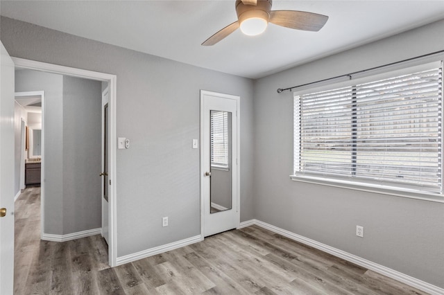 unfurnished bedroom with light hardwood / wood-style flooring and ceiling fan