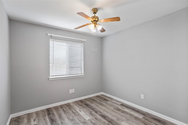 unfurnished room with ceiling fan and light hardwood / wood-style flooring