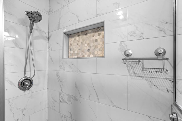 bathroom with tiled shower