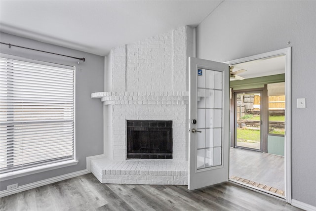 6329 Peggy Dr, Fort Worth, TX 76133 - unfurnished living room featuring baseboards, a fireplace, and wood finished floors