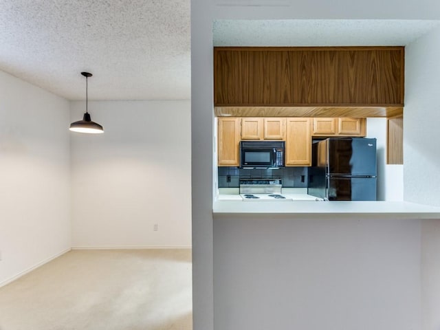 kitchen with black appliances, a textured ceiling, hanging light fixtures, light colored carpet, and backsplash