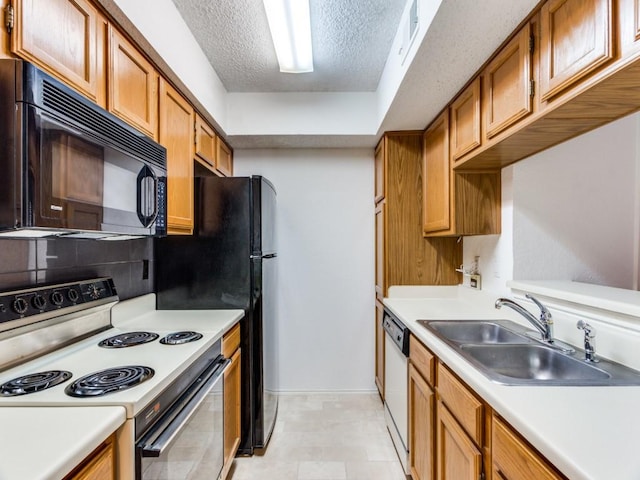 kitchen with range with electric stovetop, dishwasher, sink, decorative backsplash, and a textured ceiling