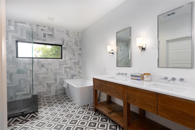 bathroom featuring vanity and separate shower and tub