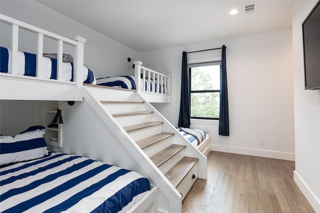 bedroom with light wood-type flooring