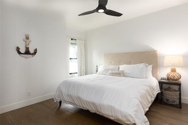 bedroom with ceiling fan and dark hardwood / wood-style flooring