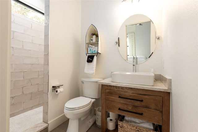 201 Seaside Dr, Gun Barrel City, TX 75156 - bathroom featuring toilet, vanity, and a tile shower