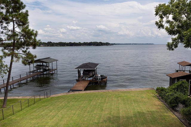 dock area featuring a water view and a yard