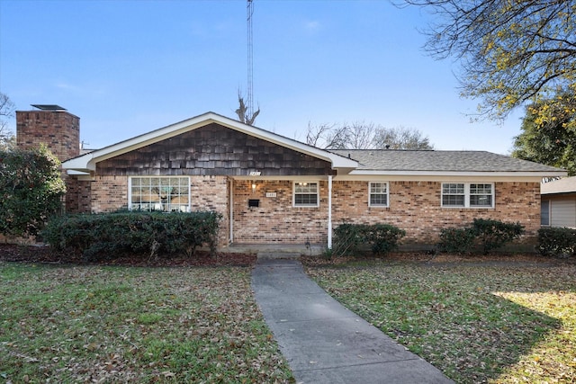 ranch-style house with a front yard