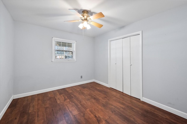 unfurnished bedroom with a closet, dark hardwood / wood-style floors, and ceiling fan