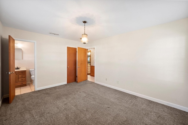 carpeted spare room featuring sink