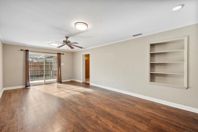 unfurnished room with hardwood / wood-style flooring, ornamental molding, ceiling fan, and built in shelves