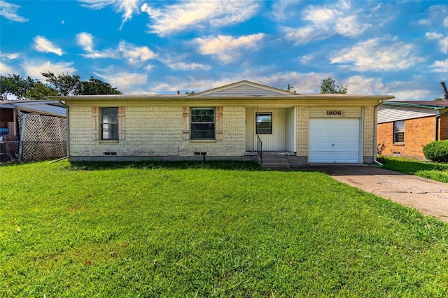 single story home featuring a garage and a front yard