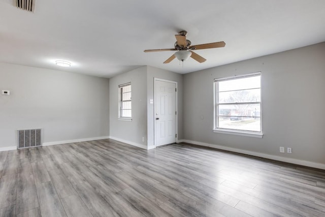 spare room with ceiling fan and light hardwood / wood-style flooring