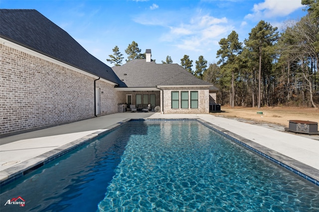 view of pool featuring a patio