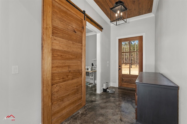 doorway featuring wood ceiling and a barn door