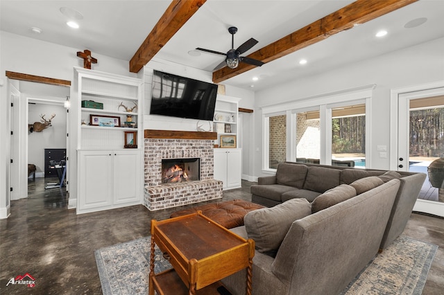 living room featuring a brick fireplace, beam ceiling, and ceiling fan