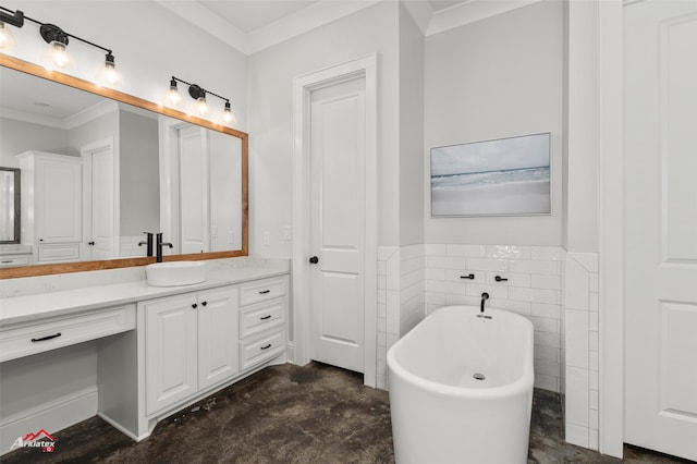 bathroom featuring concrete flooring, tile walls, a bathtub, ornamental molding, and vanity