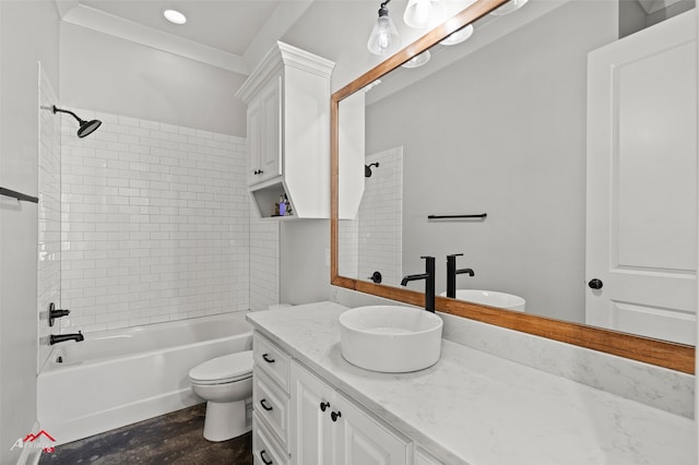 full bathroom with tiled shower / bath combo, vanity, and toilet