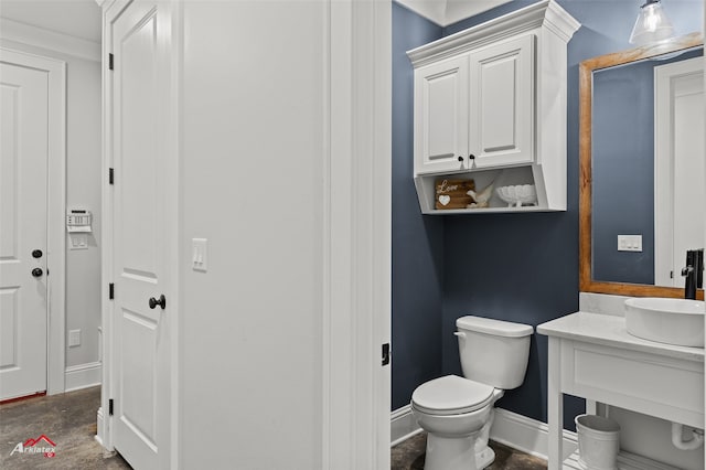 bathroom featuring vanity and toilet