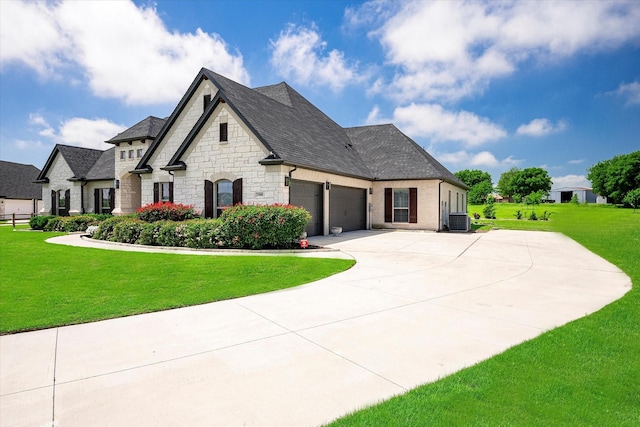 french country home featuring cooling unit and a front yard