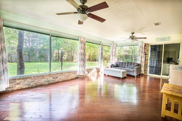 1225 Crestwood Dr, Cleburne, TX 76033 - sunroom / solarium with hardwood / wood-style floors, ceiling fan, visible vents, and plenty of natural light