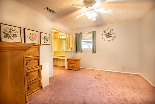 1225 Crestwood Dr, Cleburne, TX 76033 - bedroom with visible vents, carpet flooring, ensuite bath, and a textured ceiling