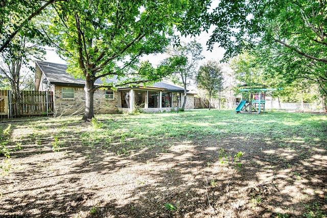 1225 Crestwood Dr, Cleburne, TX 76033 - view of yard with a fenced backyard and a playground