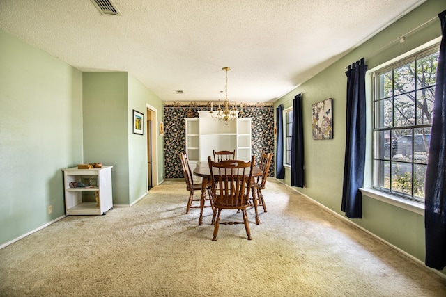 1225 Crestwood Dr, Cleburne, TX 76033 - dining area with an inviting chandelier, carpet, and a wealth of natural light