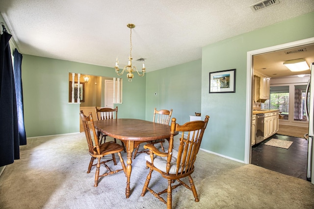 1225 Crestwood Dr, Cleburne, TX 76033 - dining area with visible vents, baseboards, a chandelier, a textured ceiling, and light carpet