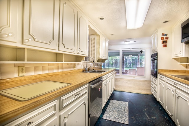 1225 Crestwood Dr, Cleburne, TX 76033 - kitchen featuring a sink, wooden counters, white cabinetry, and stainless steel appliances