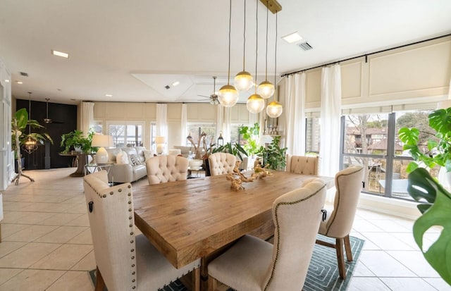 dining room featuring visible vents, ceiling fan, and light tile patterned floors