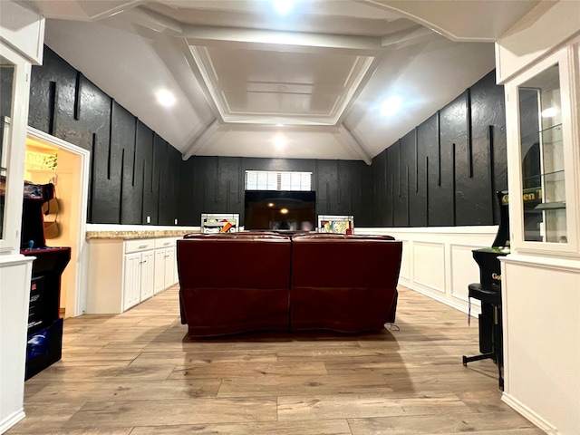 interior space featuring light wood-type flooring and a decorative wall