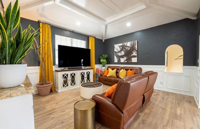 cinema room with beam ceiling and light hardwood / wood-style floors