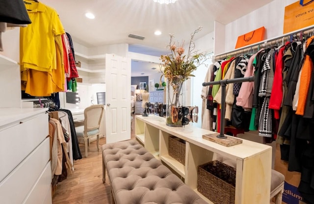 spacious closet with light wood-type flooring and visible vents