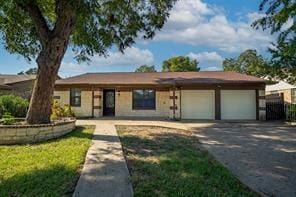 single story home featuring a garage