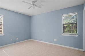 spare room with ceiling fan