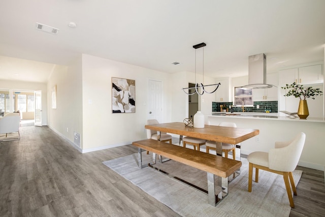 dining space featuring light hardwood / wood-style flooring